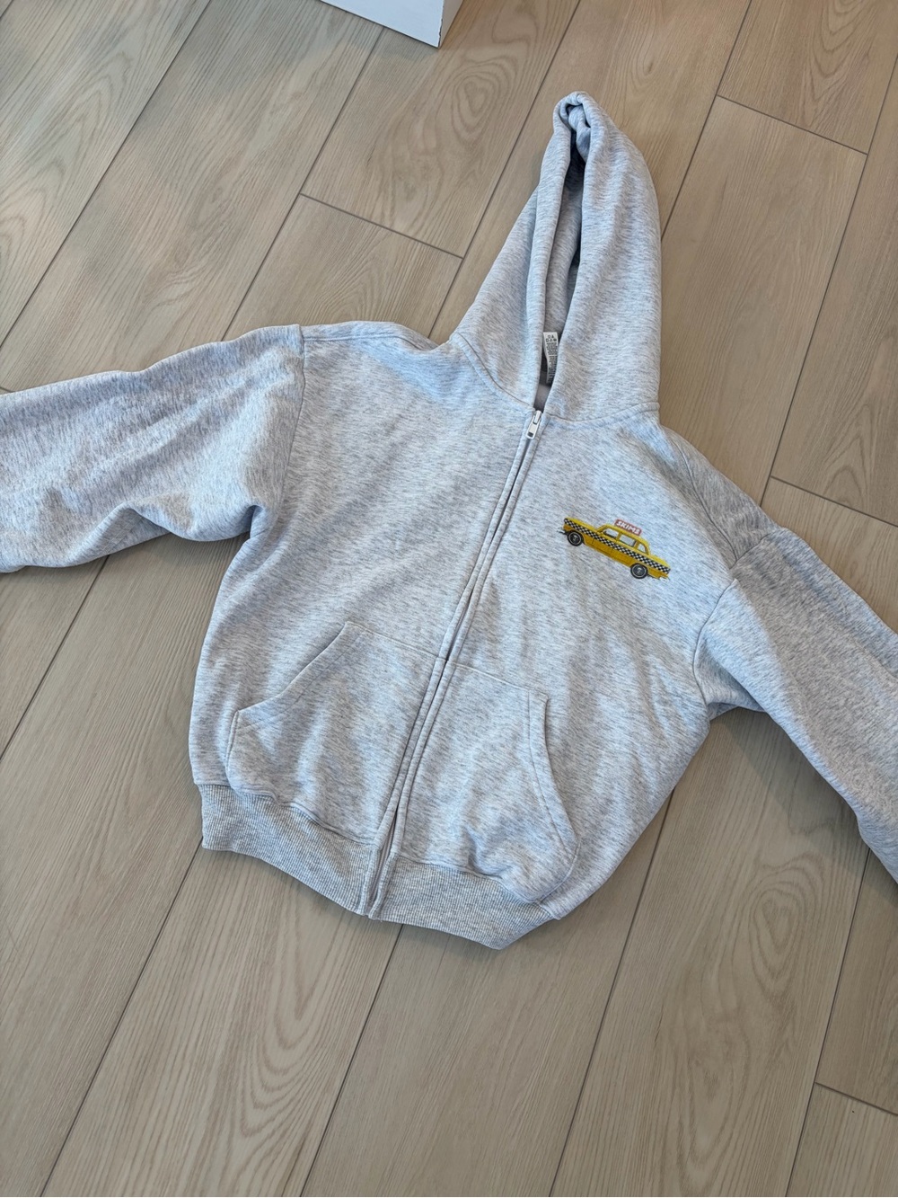 SKIMS Light Gray Zip Hoodie with Yellow Taxi Patch